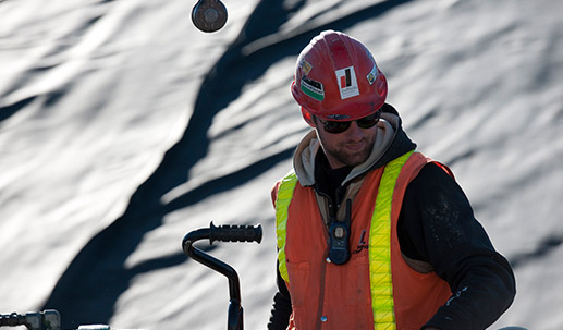 Dufferin Construction Employee in Red Hard Hat